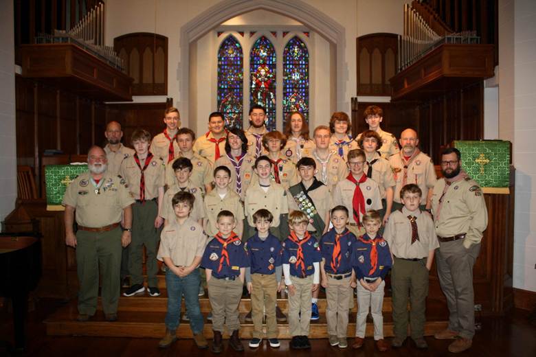 A group of people posing for a photo

Description automatically generated